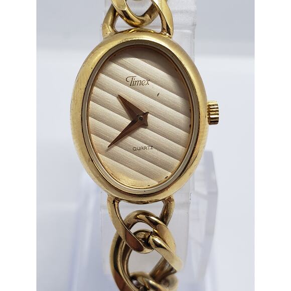 Women\'s Timex dress watch. Gold oval face with lined design. main image 7